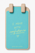 A turquoise and beige grip mat featuring the motivational quote 'I MOVE WITH confidence' in yellow text, with 'grip mat studio' printed at the bottom.