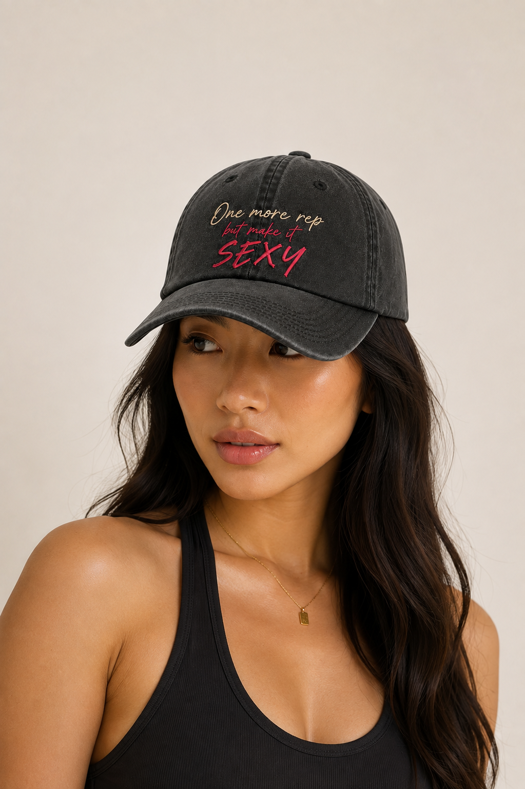 Woman wearing One More Rep washed charcoal Pilates hat by Grip Mat Studio
