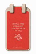A red grip mat with a beige border and two beige handles at the top, featuring white text that reads 'MENTALLY THREE APEROLS DEEP WITH THE SUN ON MY FACE' and a small white leaf illustration, on a white background.
